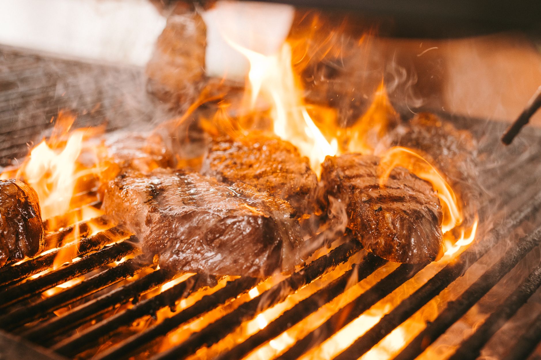 Live-fire restaurant kitchen with mesquite grill inside a Phoenix hotel