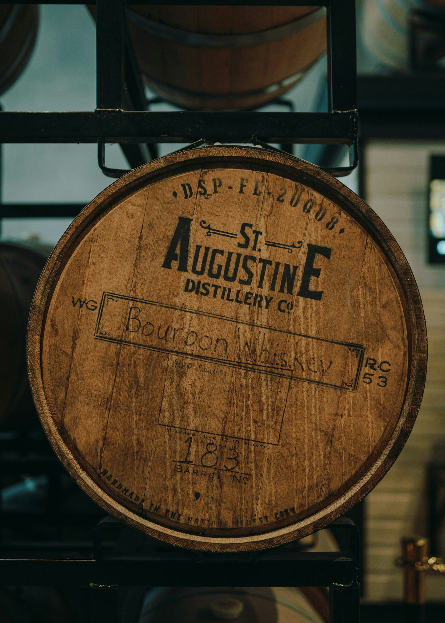 Whisky casks stacked inside a distillery ageing warehouse