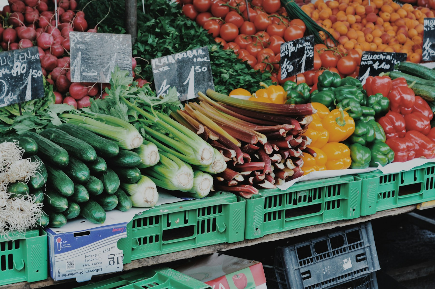 Crates of vegetables stacked at a wholesale produce market