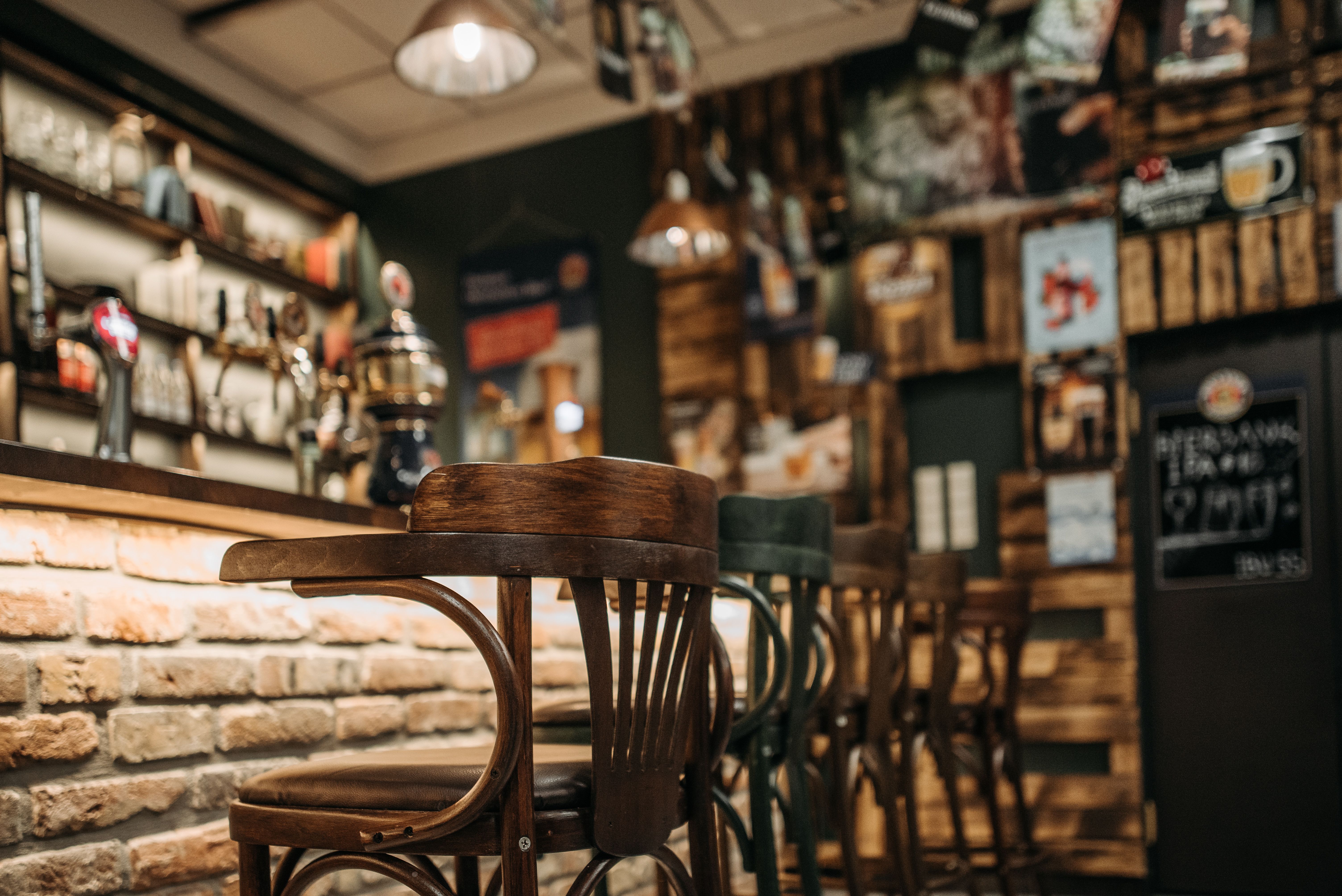 Bentwood bar stools along the counter of a traditional pub