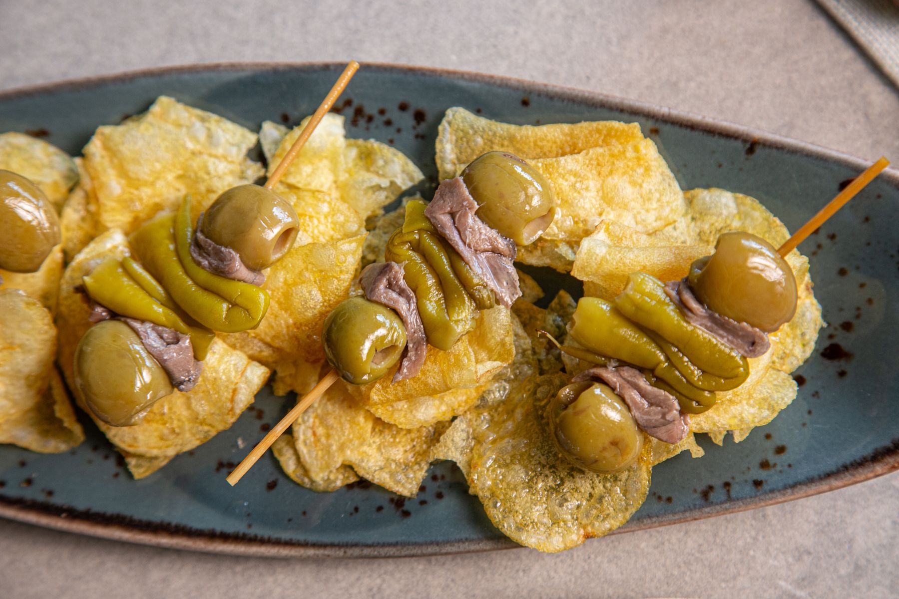 Gilda pintxos of olives, anchovies and guindilla peppers on skewers