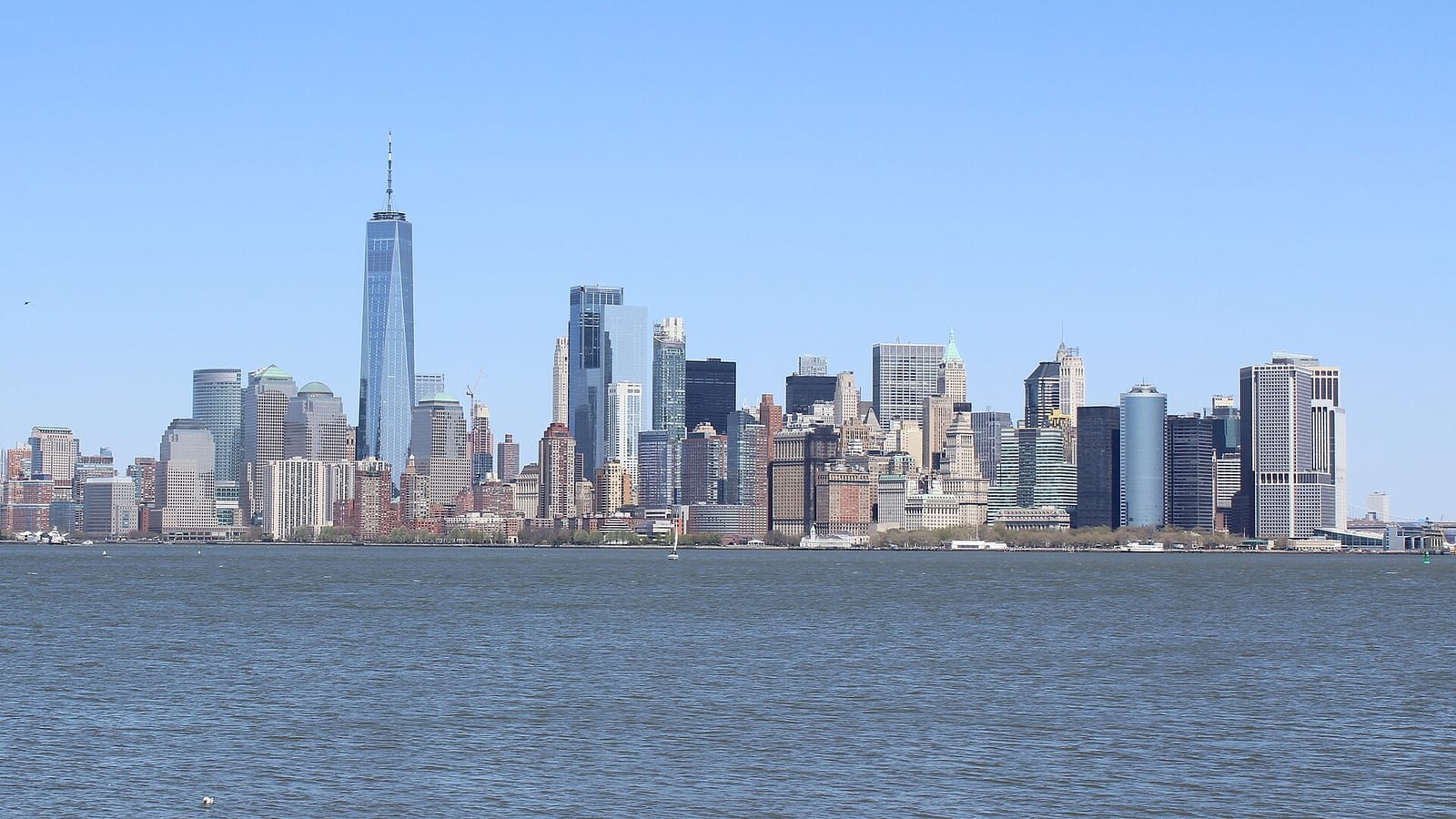 The Lower Manhattan skyline seen across the water from Liberty Island