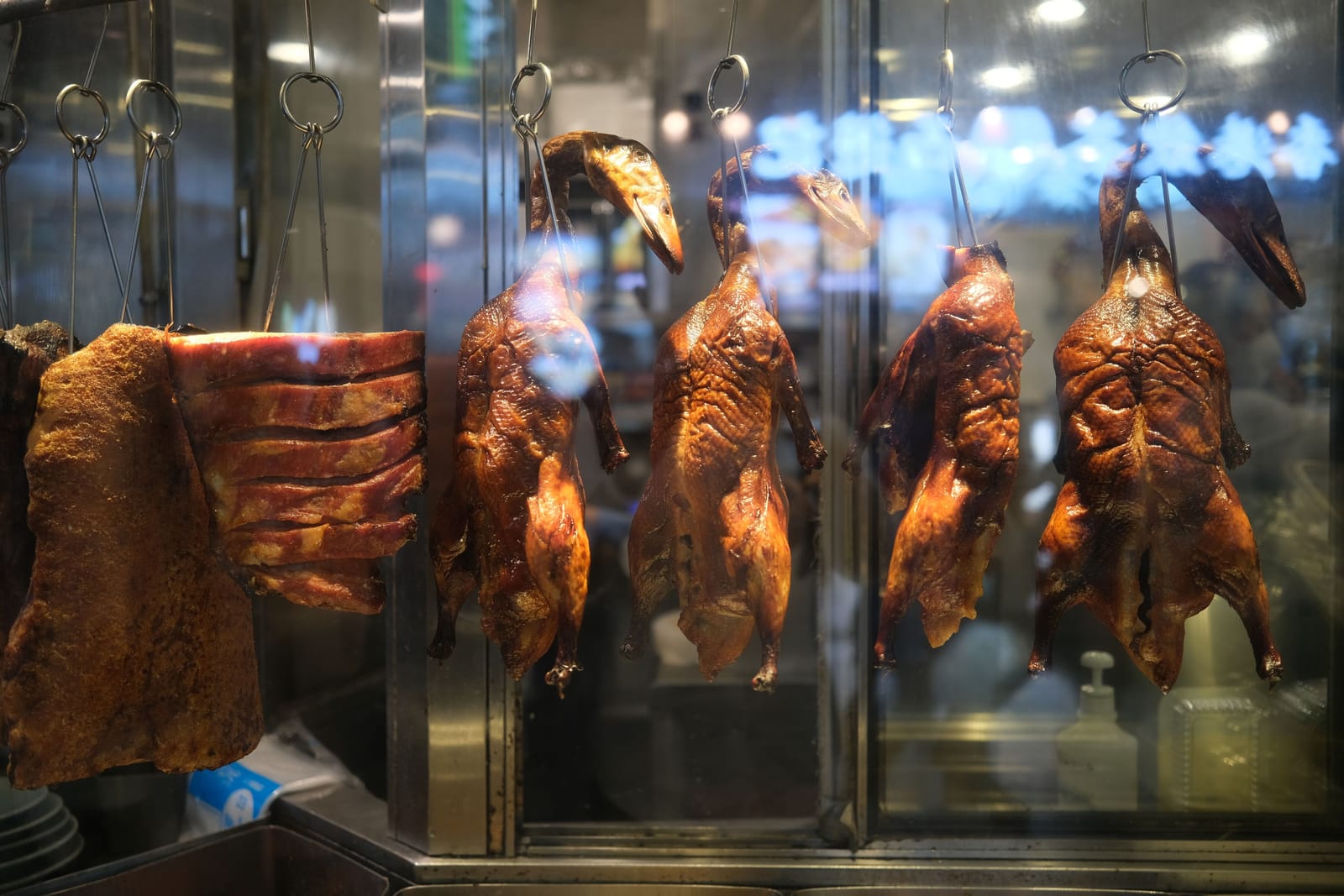 Roast ducks hanging in the window of a Hong Kong Cantonese restaurant