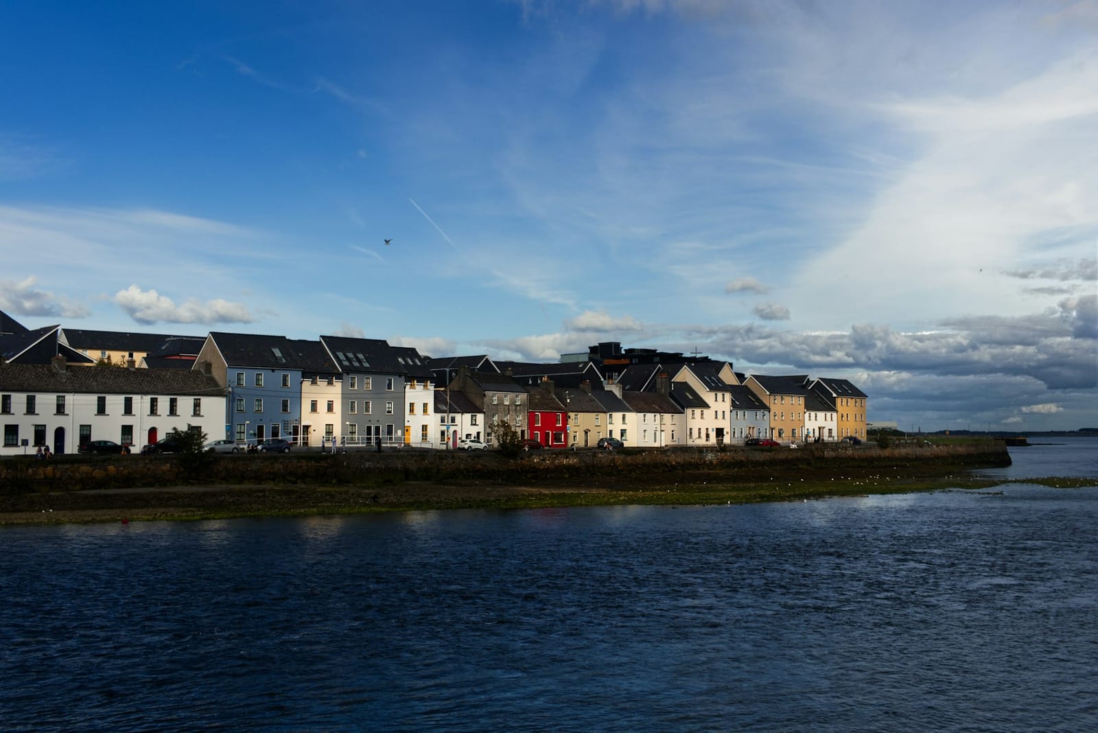 Colourful houses along the waterfront in a west of Ireland coastal town